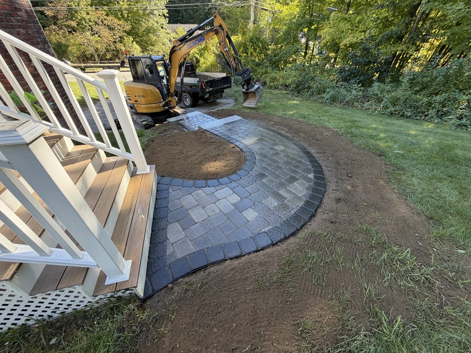 Curved paver walkway with dark border
