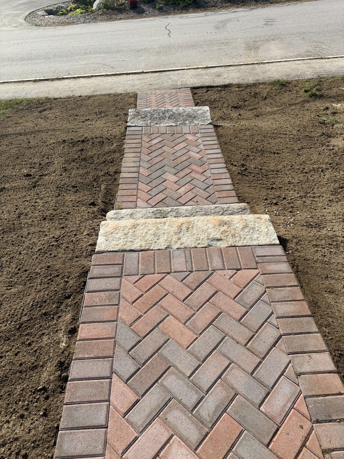 Herringbone brick paver walkway
