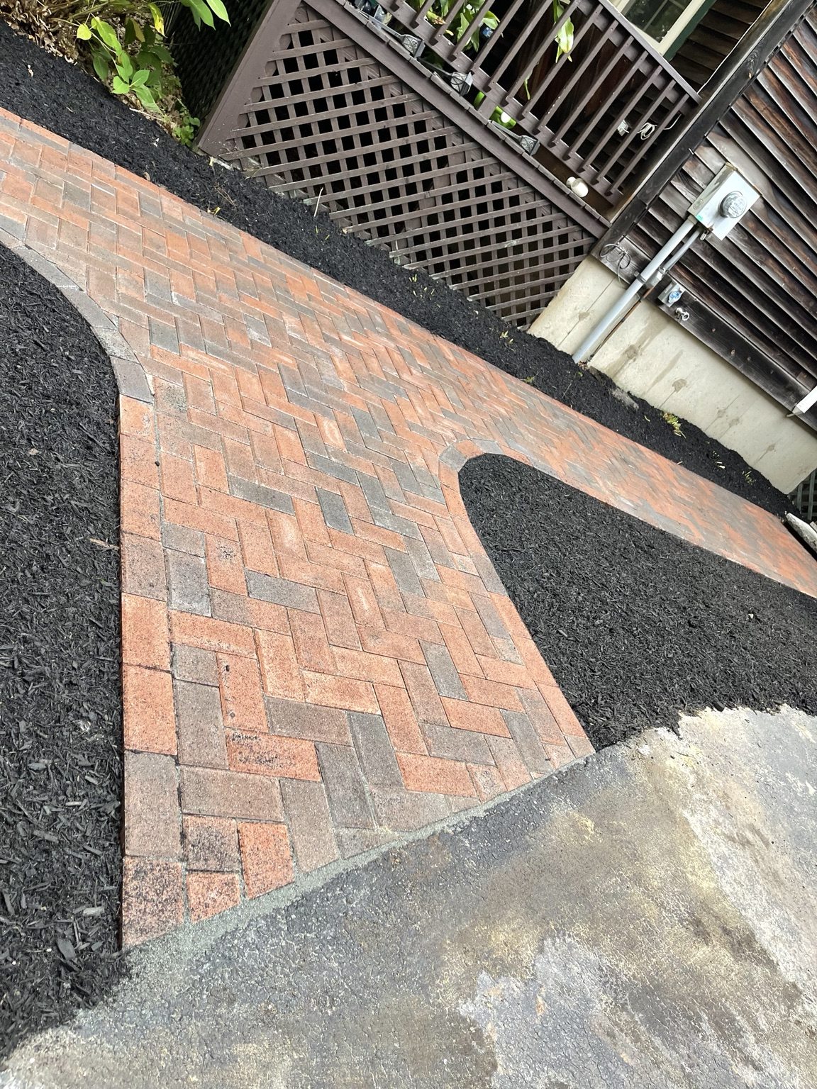 Red herringbone paver walkway