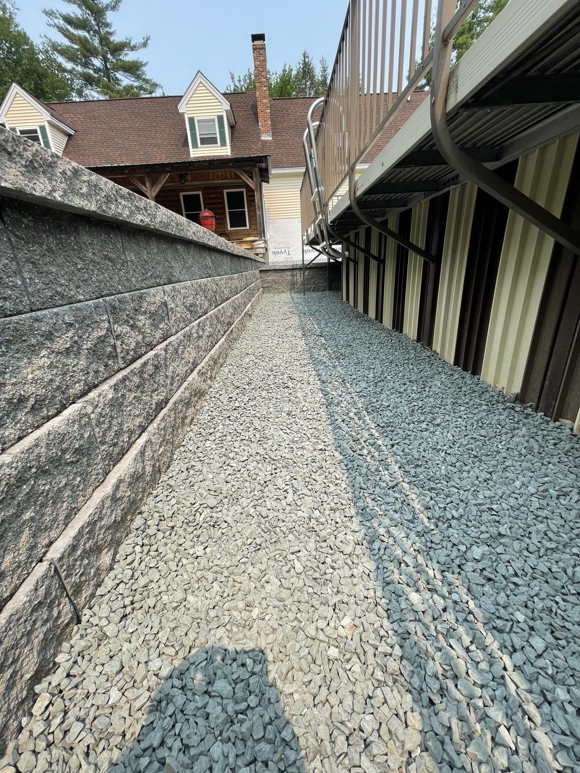 Retaining wall and drainage stone