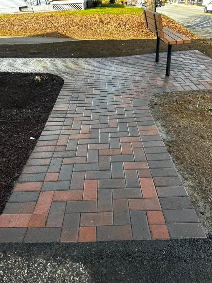 Herringbone paver walkway with seating area