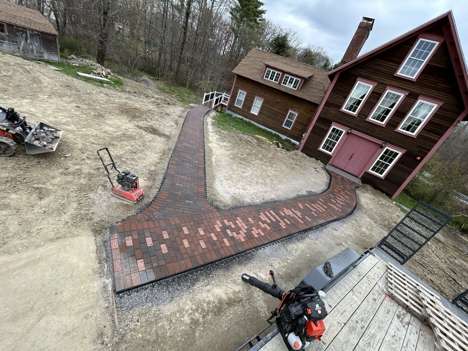 Red and charcoal paver walkways
