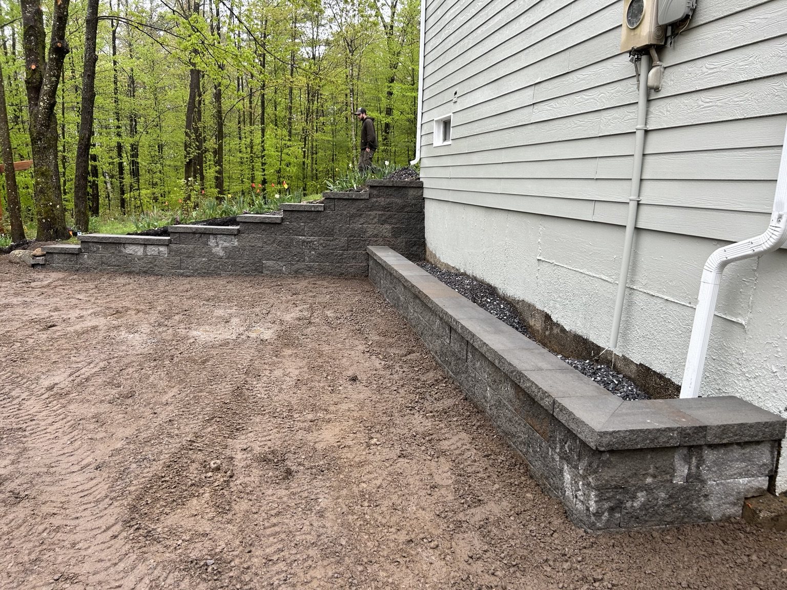 Terraced retaining walls beside home