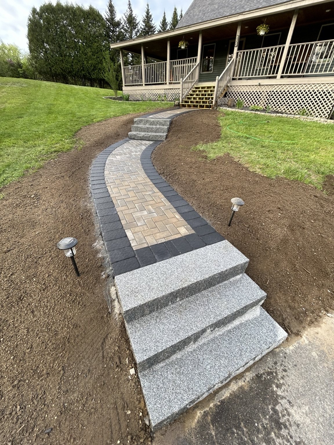 Curved walkway with granite stairs