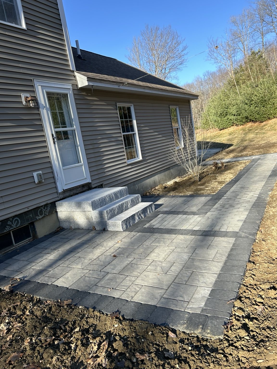Paver patio and granite entry steps