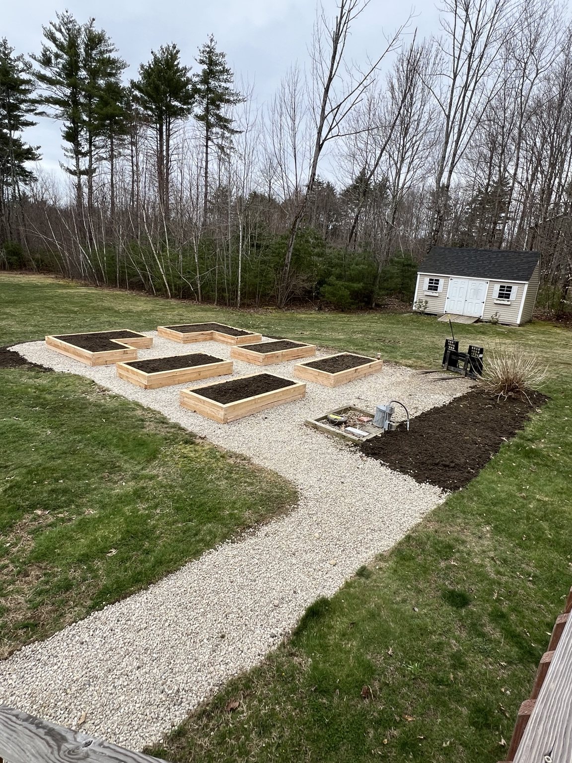 Raised garden beds with gravel paths